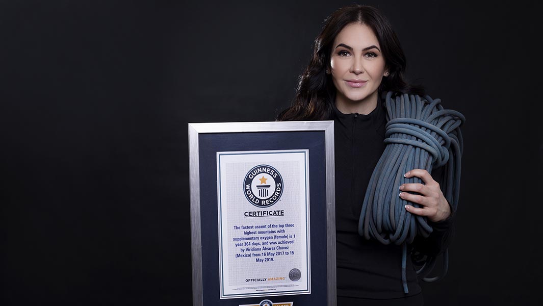 viridiana-holding-certificate-with-mountaineer-gear_tcm25-626194